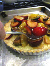 Spooning Sugared Plums Into a Par-Cooked Tart Crust
